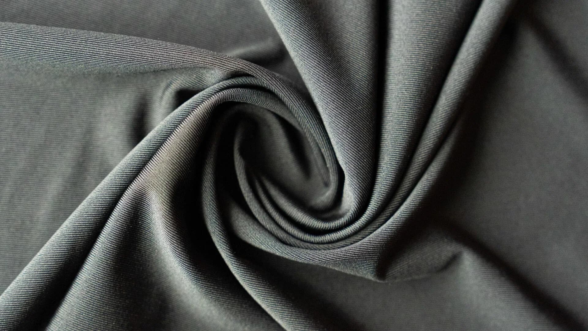 Graphite Yusuf Uçar Örme Kumaş interlock fabric in a circular fold